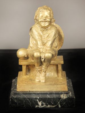 Early 20th Century Gilt Bronze Sculpture of a Child Seated on a Marble Base by Juan Clara