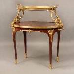 Gilt bronze two tier tea table