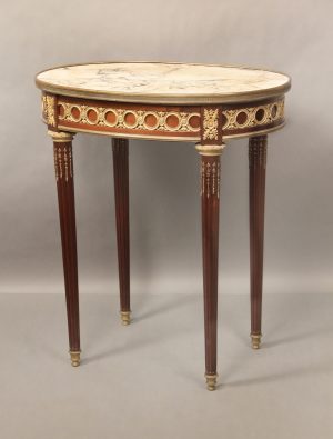 A Late 19th Century Louis XVI Style Gilt Bronze Mounted Marble Top Lamp Table