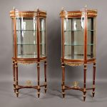 Pair of gilt bronze mounted demilune vitrines