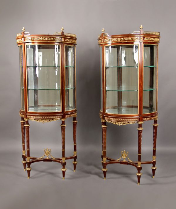 Pair of gilt bronze mounted demilune vitrines