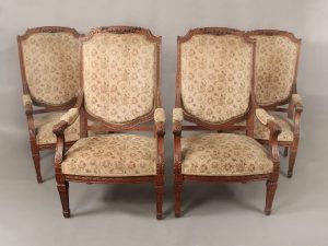An Impressive Set of Four Late 19th Century Louis XVI Style Carved Wood Armchairs
