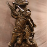 Bronze figurine of two soldiers.
