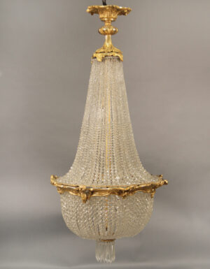 A Late 19th Century Gilt Bronze and Crystal Seven Light Basket Chandelier
